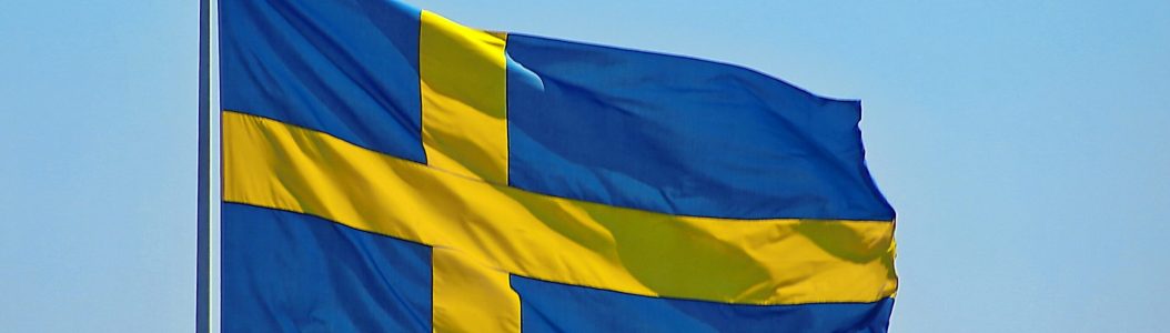 © Photo by Mark König /Unsplash/(Flag of Sweden.)